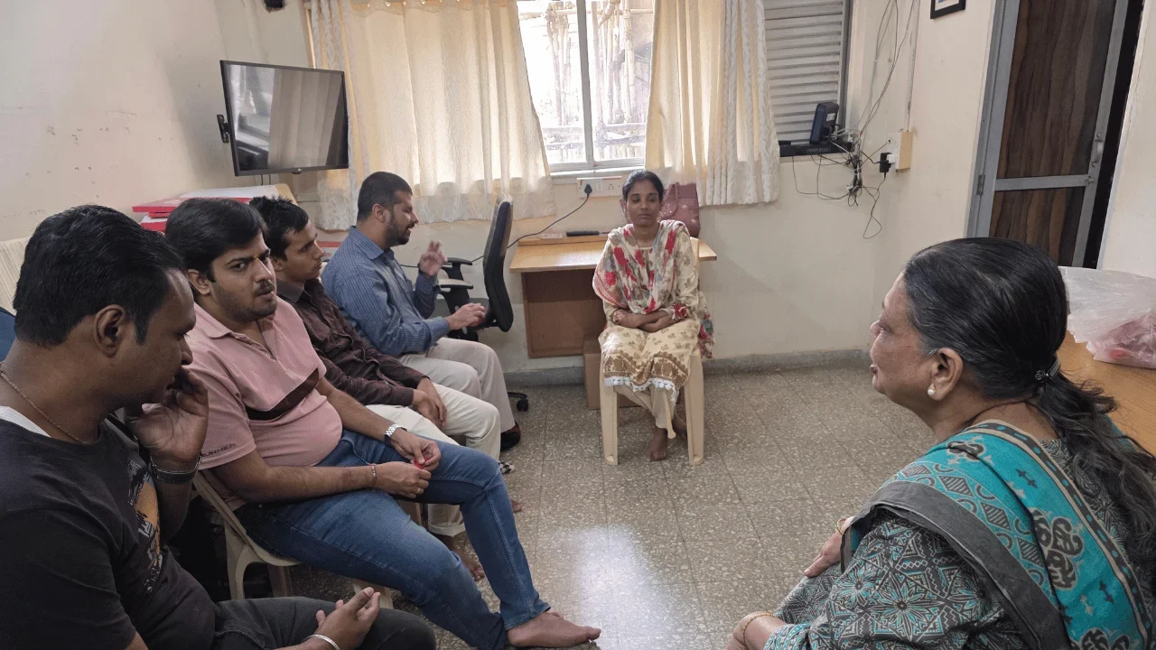Small group seated in a room for discussion, guidance, and personal support.