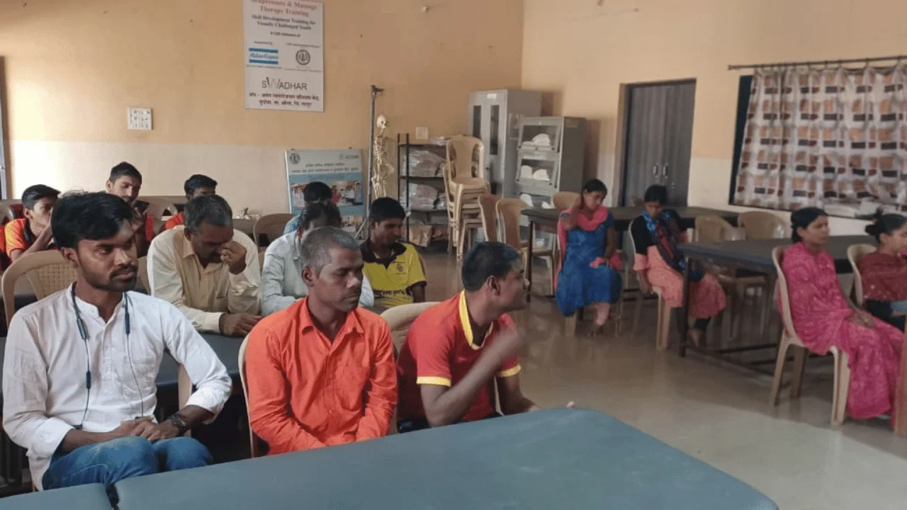 Young men seated together during a hostel, training, or support centre activity.